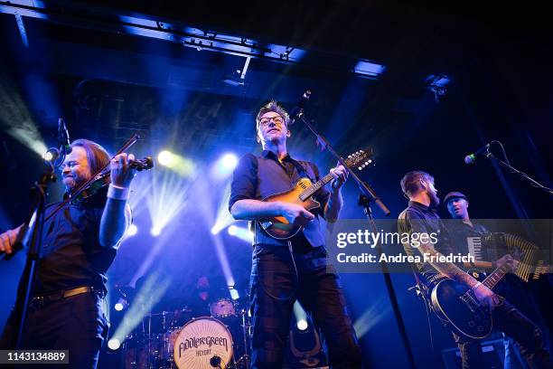 Tobias Heindl, Frank Jooss, Ralf Albers, Patrick Prziwara, and Stefan Klug of Fiddler's Green perform live on stage during a concert at Columbia...