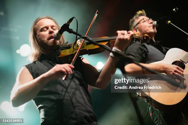 Tobias Heindl and Ralf Albers of Fiddler's Green perform live on stage during a concert at Columbia Theater on May 11, 2019 in Berlin, Germany.