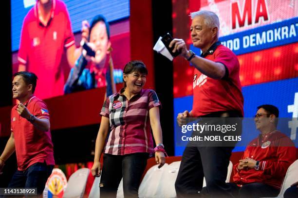 Imee Marcos , daughter of the late Philippine dictator Ferdinand Marcos, dances with other senatorial candidates of the Partido Demokratiko...