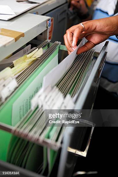 filing hand - filing documents stock pictures, royalty-free photos & images