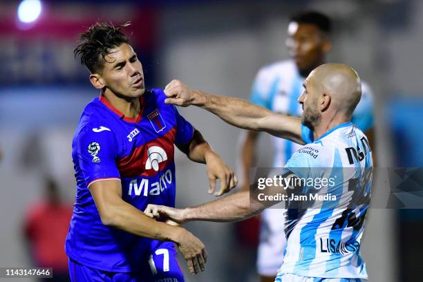 Lisandro Lopez of Racing Club fights with Matias Acuna of Tigre during a first leg quarter final match between Tigre and Racing Club as part of Copa...