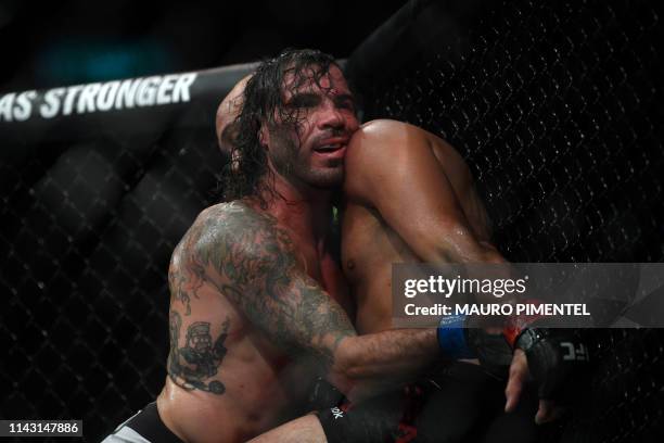 Fighter BJ Penn competes against US fighter Clay Guida during their men's lightweight bout at the Ultimate Fighting Championship 237 event at...