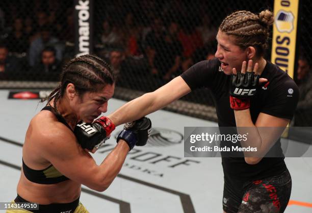 Irene Aldana of Mexico punches Bethe Correia of Brazil in their women's bantamweight bout during the UFC 237 event at Jeunesse Arena on May 11, 2019...