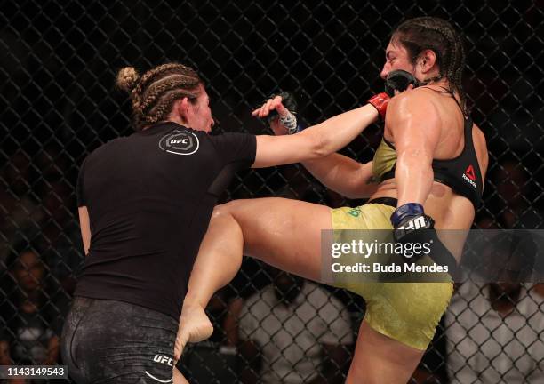 Irene Aldana of Mexico punches Bethe Correia of Brazil in their women's bantamweight bout during the UFC 237 event at Jeunesse Arena on May 11, 2019...