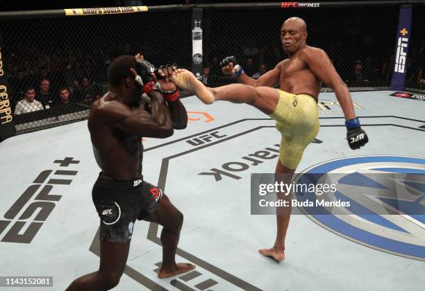 Anderson Silva of Brazil kicks Jared Cannonier in their middleweight bout during the UFC 237 event at Jeunesse Arena on May 11, 2019 in Rio De...