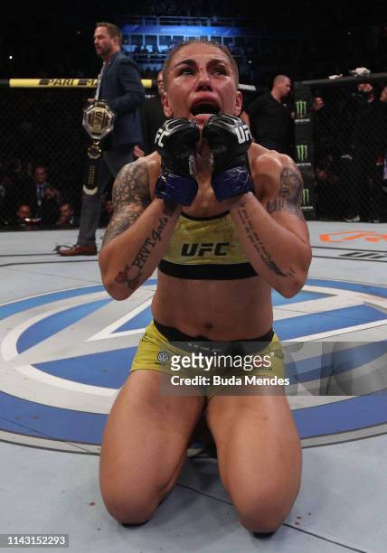 Jessica Andrade of Brazil celebrates after her knockout victory over Rose Namajunas in their women's strawweight championship bout during the UFC 237...