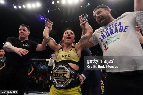 Jessica Andrade of Brazil celebrates after her knockout victory over Rose Namajunas in their women's strawweight championship bout during the UFC 237...