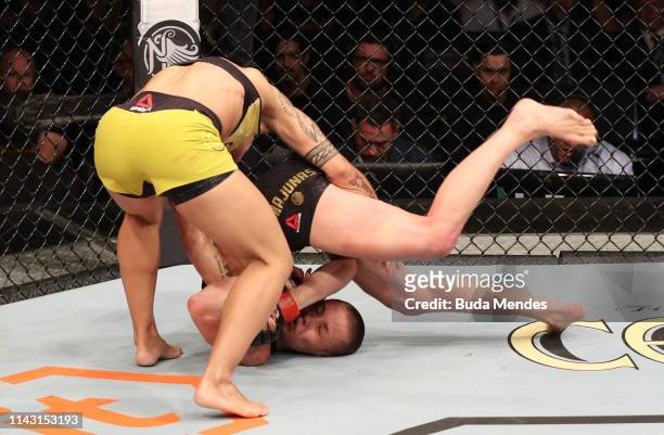 Jessica Andrade of Brazil slams Rose Namajunas, knocking her out, in their women's strawweight championship bout during the UFC 237 event at Jeunesse...