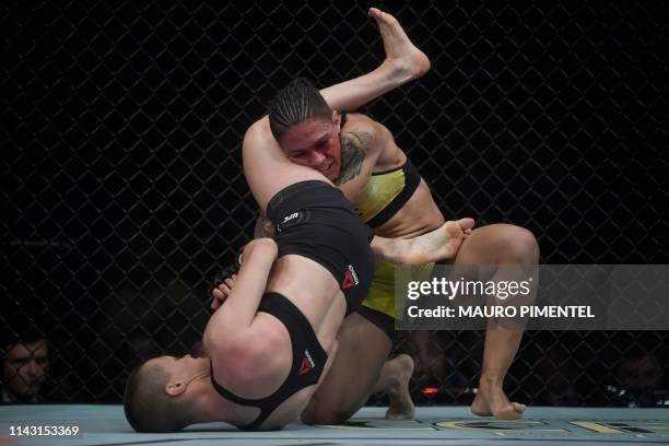 Brazilian fighter Jessica Andrade competes against US fighter Rose Namajunas during their women's strawweight title bout at the Ultimate Fighting...