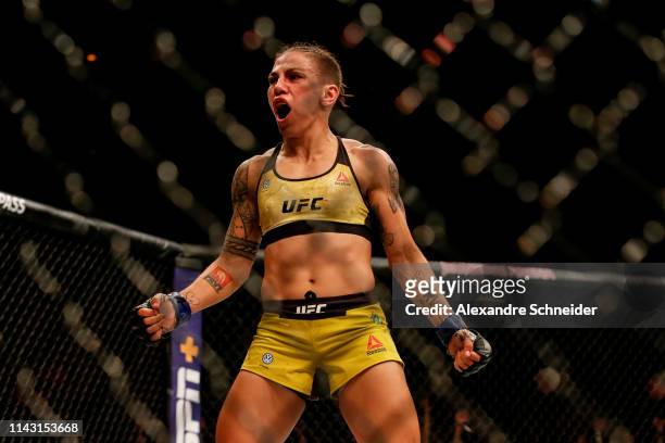 Jessica Andrade of Brazil celebrates after her knockout victory over Rose Namajunas of USA in their women's strawweight championship bout during the...