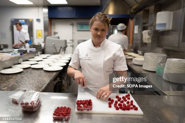 Sarah Frankland seen cutting raspberries in her pastry kitchen at the Pennyhill Park hotel where she is the head pastry chef during the Show. Sarah...