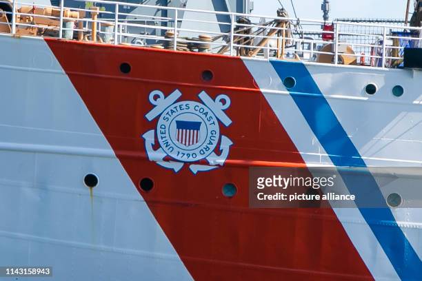 May 2019, Schleswig-Holstein, Kiel: The logo of the United States Coast Guard can be seen on the hull of the American sailing training ship "Eagle"....