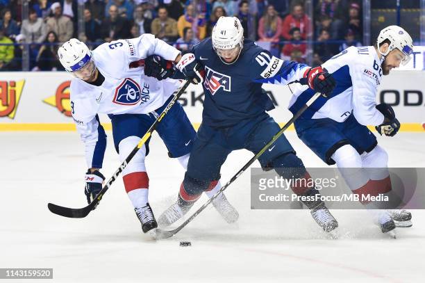 Jonathan Janil of France tackles Luke Glendening of USA during the 2019 IIHF Ice Hockey World Championship Slovakia group A game between United...