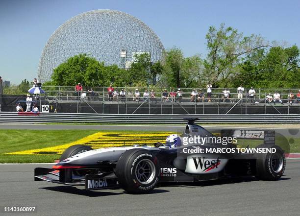 McLaren Mercedes David Coulthard from Great Britain passes the Biodome as he negotiates the hairpin during morning practice 08 June 2001 at the...