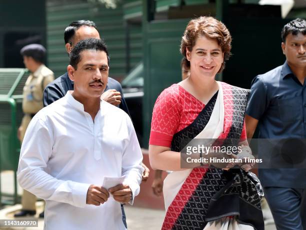 Priyanka Gandhi Vadra, the Congress general secretary and her husband Robert Vadra arrive to cast their vote at a polling booth at Lodhi Estate on...