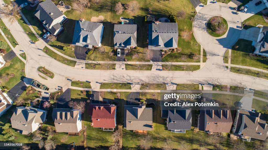 Top view directly above drone aerial view of the street in the residential neighborhood Libertyville, Vernon Hills, Chicago, Illinois.