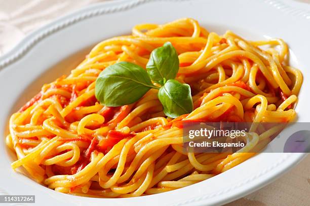 spaghetti with tomatoes and basil - marinara stock pictures, royalty-free photos & images