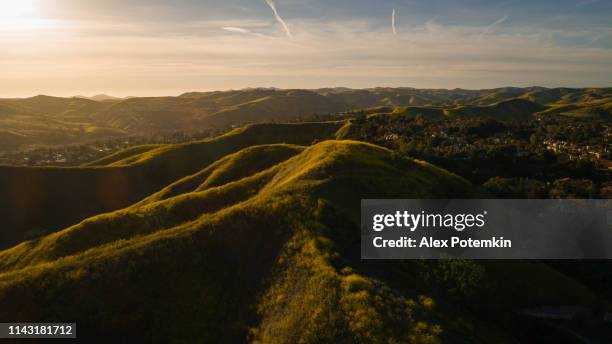 sunset on the hills of santa monica mountains, california, usa. aerial photo. - calabasas imagens e fotografias de stock