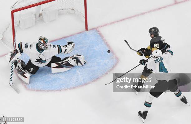 Jonathan Marchessault of the Vegas Golden Knights scores a third-period power-play goal against Aaron Dell of the San Jose Sharks as Brenden Dillon...
