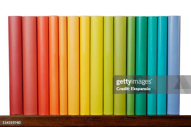 rainbow books - books on shelf stockfoto's en -beelden