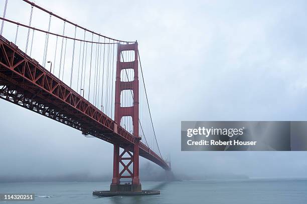golden gate bridge in clouds - under golden gate bridge stock pictures, royalty-free photos & images
