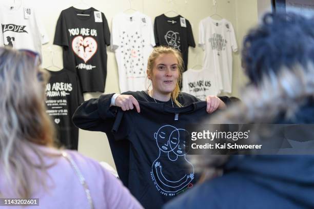 Concertgoers look at You Are Us merchandise prior to the You Are Us/Aroha Nui Concert at Christchurch Stadium on April 17, 2019 in Christchurch, New...