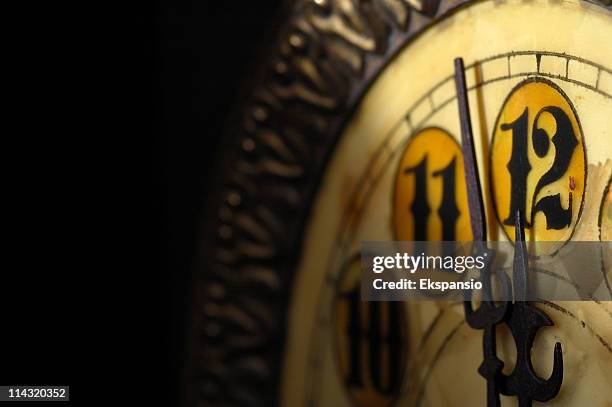 almost twelve o'clock on the clock - midnight stock pictures, royalty-free photos & images