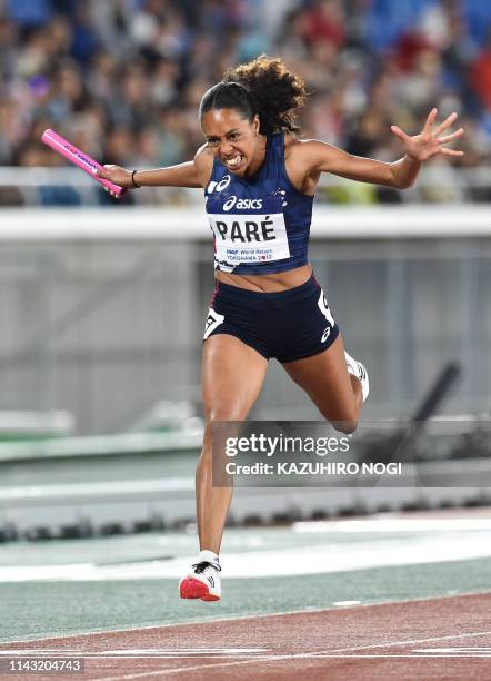 Maroussia Pare of France crosses the finish line during the women's 4x200 metres relay final at the IAAF World Relays athletics event at Nissan...