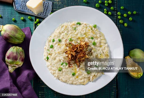 risotto with peas and artichoke - risotto stock pictures, royalty-free photos & images