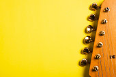 Guitar headstock on yellow
