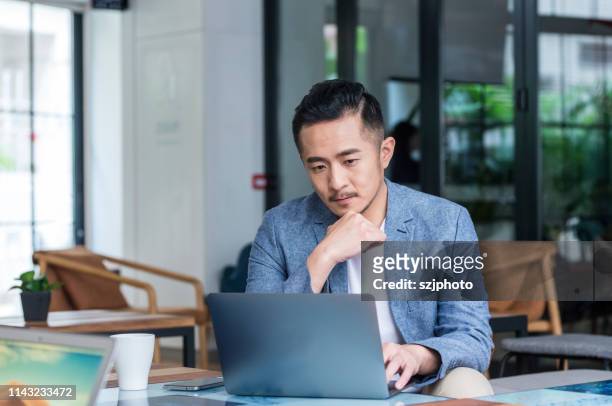 casual office young man - chinese male confident stock pictures, royalty-free photos & images