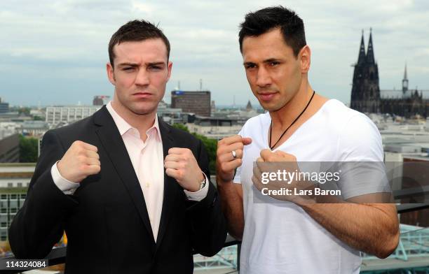 Matthew Macklin of Ireland poses with Felix Sturm of Germany during the Felix Sturm v Matthew Macklin press conference at Hotel Im Wasserturm on May...