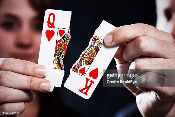 torn playing cards symbolize divorce - queen card stock pictures, royalty-free photos & images