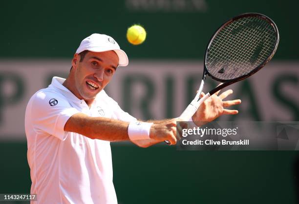 Mikhail Kukushkin of Kazakhstan plays a backhand against Stefanos Tsitsipas of Greece in their second round match during day four of the Rolex...