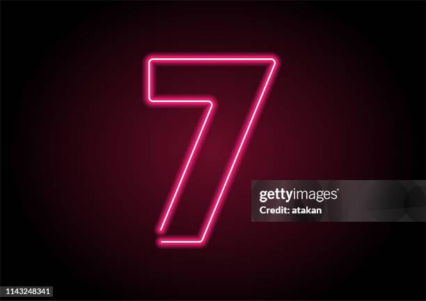 number 7 red neon light on black wall - number-one-black-background stock illustrations