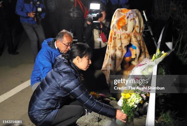 Takuya Yamato, right, and his wife, Shinobu, visit the site where their son Hikaru died in a landslide in 2016 triggered by an earthquake in Kumamoto...