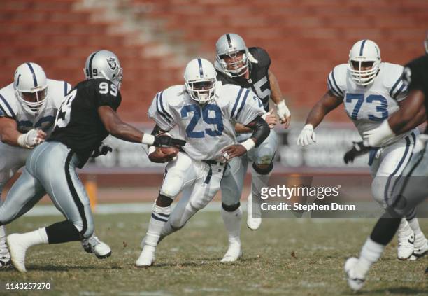 Eric Dickerson, Running Back for the Indianapolis Colts runs the ball against the Los Angeles Raiders during their National Football Conference West...