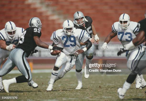 Eric Dickerson, Running Back for the Indianapolis Colts runs the ball against the Los Angeles Raiders during their National Football Conference West...