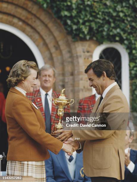Tony Jacklin of Great Britain and captain of the European team receives the Ryder Cup from Lady Derby to celebrate Europe winning the 26th Ryder Cup...