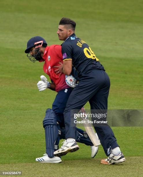 Essex batsman Varun Chopra collides with Glamorgan bowler Marchant de Lange during the Royal London One Day Cup match between Glamorgan and Essex at...