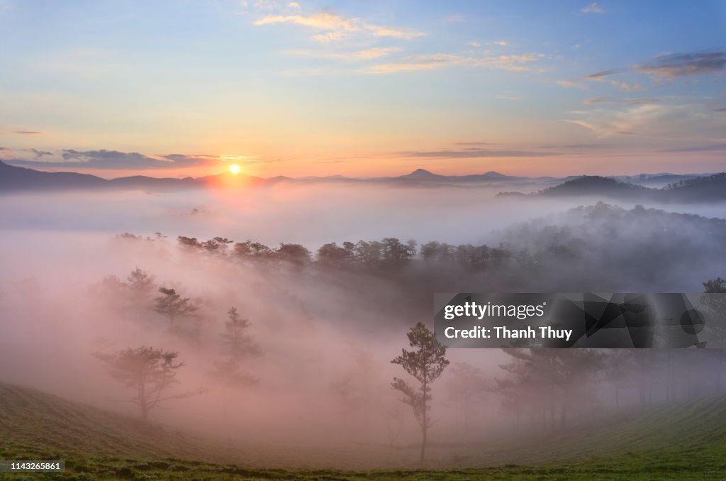 Sunrise on mountain valley of cloud