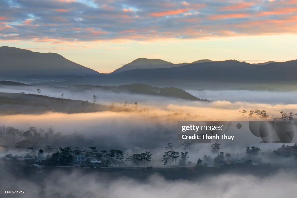 Sunrise on mountain valley of cloud