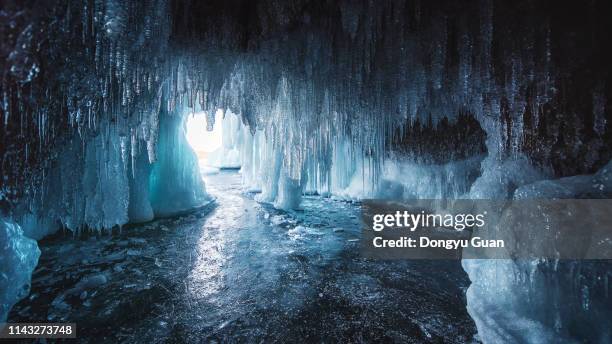 blue ice cave on olkhon island - icicle imagens e fotografias de stock