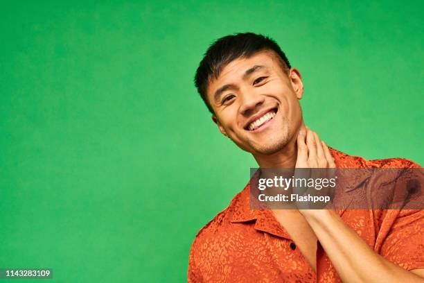 colourful studio portrait of a young man - beautiful people asian stock pictures, royalty-free photos & images