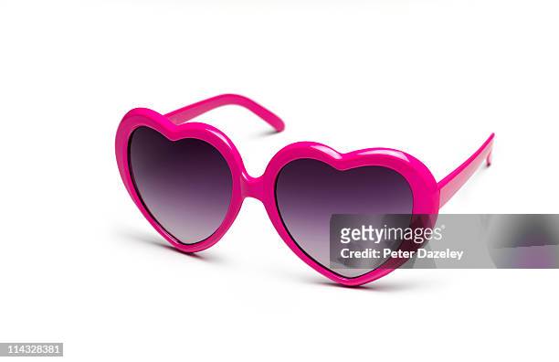 heart shaped sunglasses on white background - sunglasses stock-fotos und bilder
