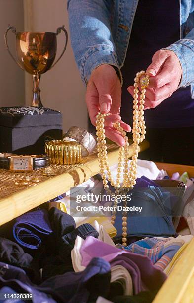 burglar going through bedroom draws - jewelry robbery stock pictures, royalty-free photos & images