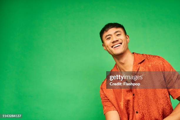 colourful studio portrait of a young man - portrait man studio foto e immagini stock