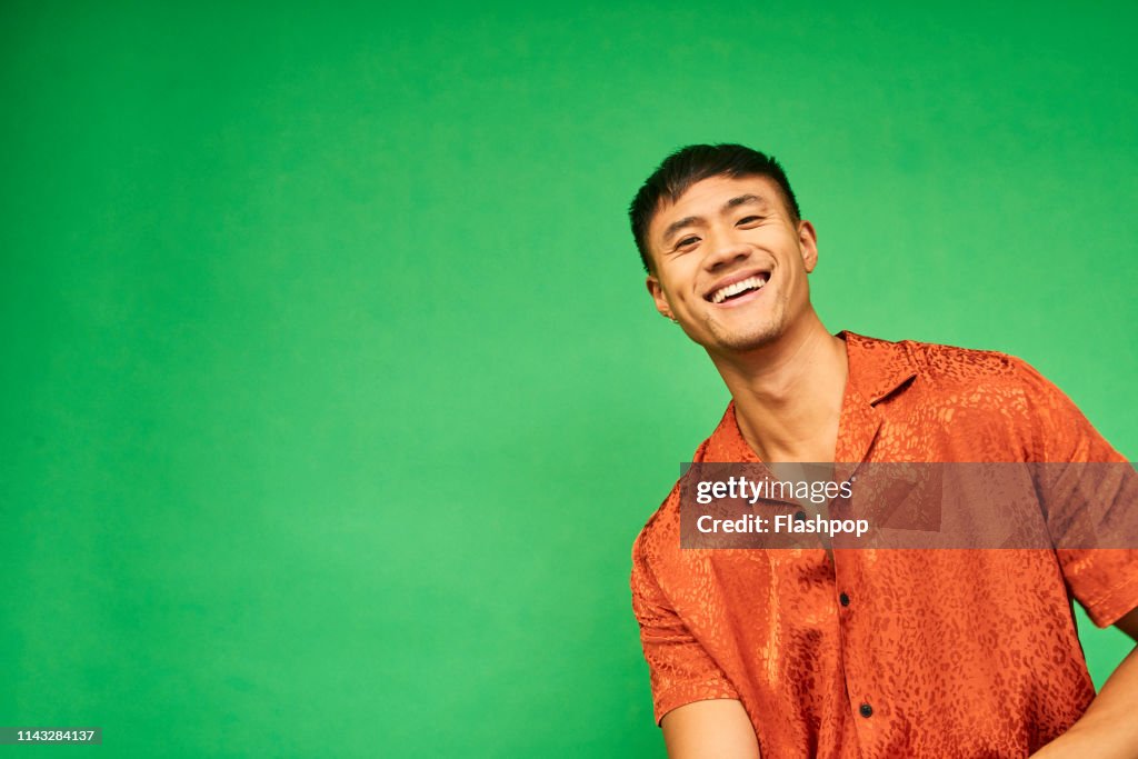 Colourful studio portrait of a young man