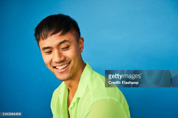 colourful studio portrait of a young man - asian man potrait stock pictures, royalty-free photos & images