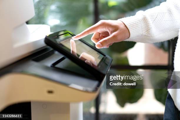 finger tounch screan of printer - computer printer stock pictures, royalty-free photos & images
